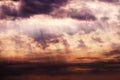 Dark ominous clouds. Dramatic sky with sunbeams Royalty Free Stock Photo