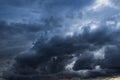 Dark ominous storm clouds form a textured background element