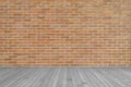 Dark orange brown brick wall texture background with wooden floor in grey Royalty Free Stock Photo