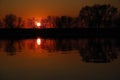 Dark orange sunset over the river Royalty Free Stock Photo