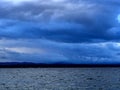 Dark overcast sky over the lake on a summer evening, gloomy clouds Royalty Free Stock Photo