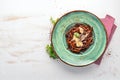 Dark pasta with parmesan cheese. Italian cuisine. On a wooden background. Free copy space. Royalty Free Stock Photo