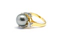 Dark pearl with diamond and gold ring isolated Royalty Free Stock Photo