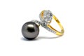 Dark pearl with diamond and gold ring isolated Royalty Free Stock Photo