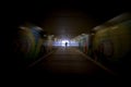 Dark pedestrian tunnel with one pedestrian, Abu Dhabi