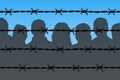 Dark people silhouettes behind barbed wire fencing Royalty Free Stock Photo