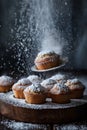 Dark photo of muffins. Above them a man\'s hand is holding a small silver sieve and sprinkles with powdered sugar Royalty Free Stock Photo