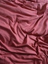 A Dark Pink Bed Sheet With Wrinkles Royalty Free Stock Photo