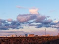 Dark pink and blue clouds over city park at dusk Royalty Free Stock Photo