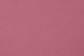 dark pink colored low contrast Concrete textured background with roughness and irregularities