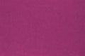 Dark pink colored paper texture. Tinted background. Textured wallpaper. Finely patterned surface. Fibers and irregularities. Top- Royalty Free Stock Photo