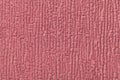 Dark pink fluffy background of soft, fleecy cloth. Texture of textile closeup Royalty Free Stock Photo