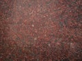 Dark pink granite background used for kitchen worktop, table, window sill, fence.Red violet igneous rock stone texture Royalty Free Stock Photo