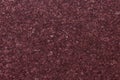 Dark pink granite background used for kitchen worktop, table, window sill, fence.Red violet igneous rock stone texture Royalty Free Stock Photo