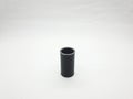 Dark plastic pipe coupling isolated against a clean white background Royalty Free Stock Photo