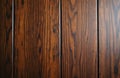 Dark polished wood panel texture, featuring vertical grain pattern and subtle knots. Ideal backdrop for natural themes, rustic Royalty Free Stock Photo