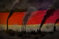 Dark pollution, fight against climate change concept - factory pipes dense smoke on Germany flag background - industrial 3D