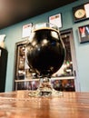 A dark porter sitting on a table