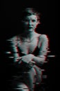 dark portrait of a beautiful girl sitting on a chair. noise is superimposed on the photo. Black and white with glitch Royalty Free Stock Photo