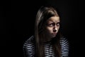 Dark portrait of a depressed teen girl Royalty Free Stock Photo