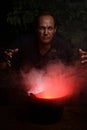 Portrait evil man with smoke and cauldron Royalty Free Stock Photo