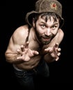 Dark portrait of scary evil sinister bearded man with smirk, makes various hand's signs and expresses different emotions