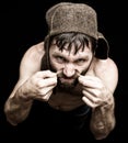 Dark portrait of scary evil sinister bearded man with smirk, makes various hand's signs and expresses different emotions