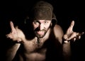 Dark portrait of scary evil sinister bearded man with smirk, makes various hand's signs and expresses different emotions