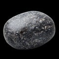 Dark Pumice Stone With Rough Texture Displayed on a Plain Background Royalty Free Stock Photo
