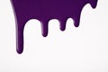 Dark purple liquid drops of paint color flow down on isolated white background. Abstract violet backdrop Royalty Free Stock Photo