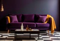 Dark purple sofa with a blanket beside a small table Royalty Free Stock Photo