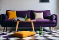 Dark purple sofa with a blanket beside a small table Royalty Free Stock Photo