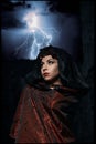 Dark queen of the ghost in a dark castle collapsed, causing lightning zipper magic hands visible destruction of the castle wall an Royalty Free Stock Photo