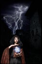 Dark queen of the ghost in a dark castle collapsed, causing lightning zipper magic hands visible destruction of the castle wall an Royalty Free Stock Photo