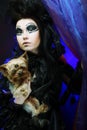 Dark queen with little dog Royalty Free Stock Photo