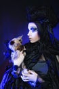 Dark queen with little dog Royalty Free Stock Photo