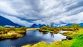 Dark rain clouds on a cold spring day at over the Pitt River and the lagoons of Pitt-Addington Marsh in Pitt Polder at Maple Ridge Royalty Free Stock Photo