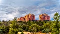 Dark rain clouds over the colorful layers of Cathedral Rock, one of the many well known red rocks near Sedona, Arizona Royalty Free Stock Photo