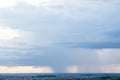 Dark Rain Clouds and Rain Over the Horizon Royalty Free Stock Photo