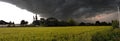 Dark rain storm clouds over the field Royalty Free Stock Photo
