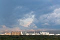 Dark rainy clouds in sunset sky over city Royalty Free Stock Photo