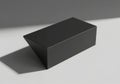 A dark rectangular prism casts a shadow isolated on white background Royalty Free Stock Photo