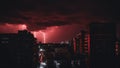 _ A dark red apocalyptic sky with bright lightning and dark shadows of people and buildings Royalty Free Stock Photo