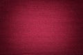 Dark red background from a textile material. Fabric with natural texture. Backdrop Royalty Free Stock Photo