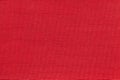 Dark red background from a textile material with wicker pattern, closeup. Royalty Free Stock Photo
