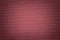 Dark red background from a textile material. Fabric with natural texture. Backdrop Royalty Free Stock Photo