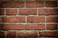 Dark red brick wall texture background with vignetted corners for design. Pattern of weathered old cracked brickwall. Stacked Royalty Free Stock Photo