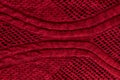 Dark red, burgundy knitted fabric texture. Rough sweater pattern background Royalty Free Stock Photo