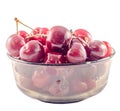 Dark-Red cherries in a brown transparent bowl, isolated, white background Royalty Free Stock Photo