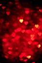Dark red color heart bokeh background photo. Abstract holiday, celebration backdrop. Royalty Free Stock Photo